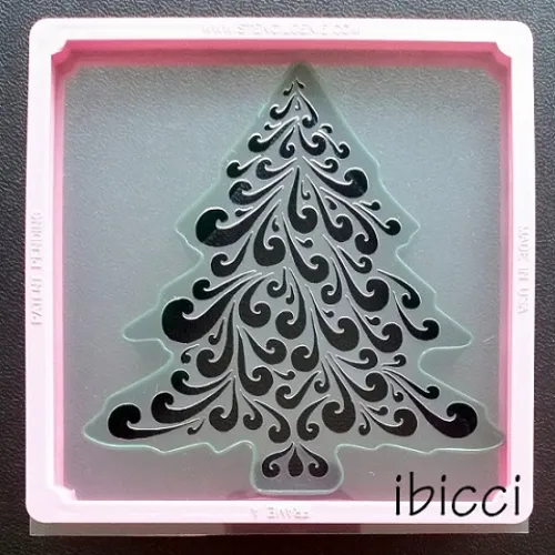 ibicci Christmas Swirl Tree stencil shown against large green tree cutter. Note: Green Tree cutter is NOT available. See Red Tree options